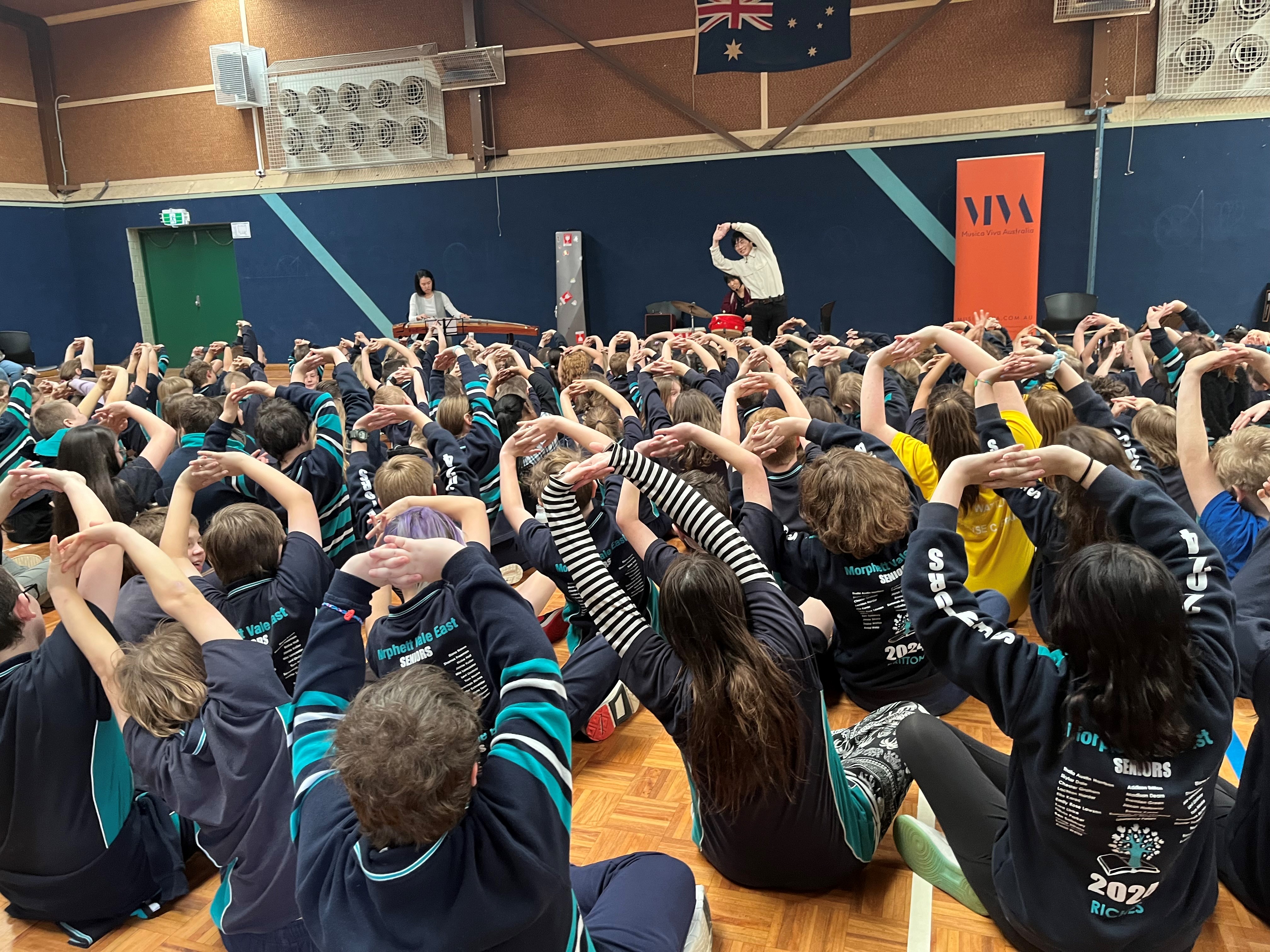 Students at Morphett Vale East Primary School make shapes with David Dai from ‘Life is an Echo’ 