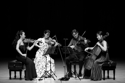 Esmé Quartet playing instruments